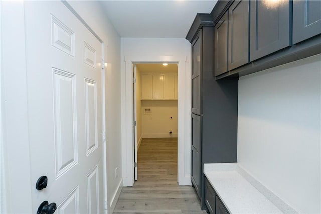 corridor featuring light hardwood / wood-style floors