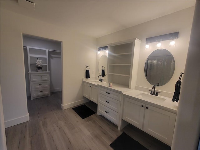 bathroom with vanity and hardwood / wood-style floors