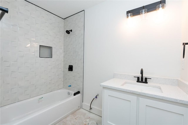 bathroom with vanity and tiled shower / bath combo