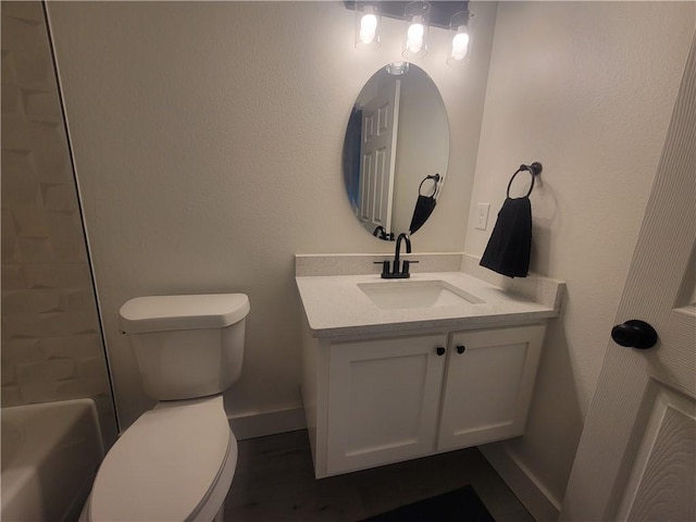 bathroom featuring vanity and toilet