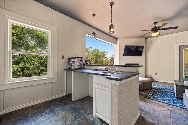 15229 Capstan St, Corpus Christi, TX 78418 - office with plenty of natural light, stone tile floors, and a ceiling fan
