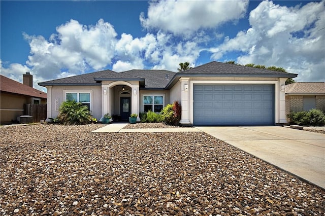 15229 Capstan St, Corpus Christi, TX 78418 - view of front of home with driveway, stucco siding, and an attached garage