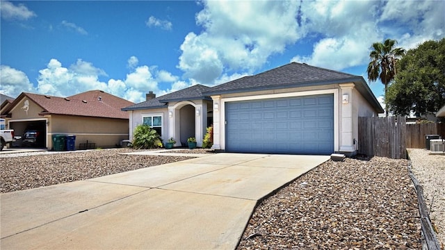 15229 Capstan St, Corpus Christi, TX 78418 - ranch-style home featuring concrete driveway, a garage, and stucco siding