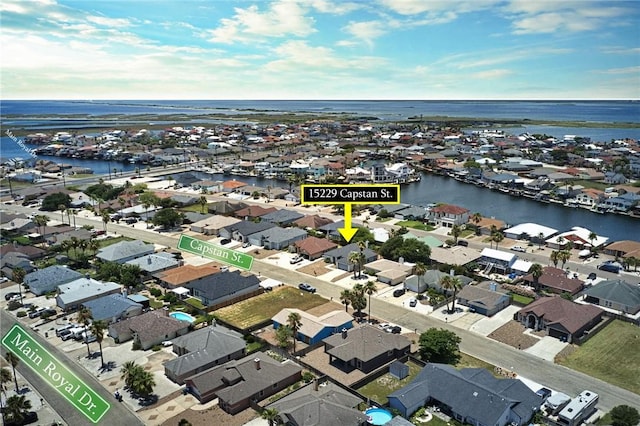 15229 Capstan St, Corpus Christi, TX 78418 - aerial view of property and surrounding area with nearby suburban area and a large body of water
