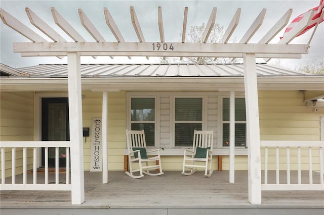 exterior space with a pergola and a porch