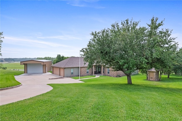 view of front facade with a garage and a front yard