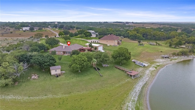 drone / aerial view with a water view and a rural view