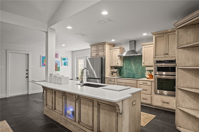 5418 Stonegate Way, Corpus Christi, TX 78411 - kitchen with wall chimney exhaust hood, stainless steel appliances, tasteful backsplash, light brown cabinetry, and light countertops