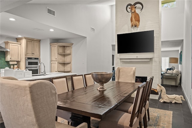 5418 Stonegate Way, Corpus Christi, TX 78411 - dining room featuring recessed lighting, a fireplace, healthy amount of natural light, and high vaulted ceiling