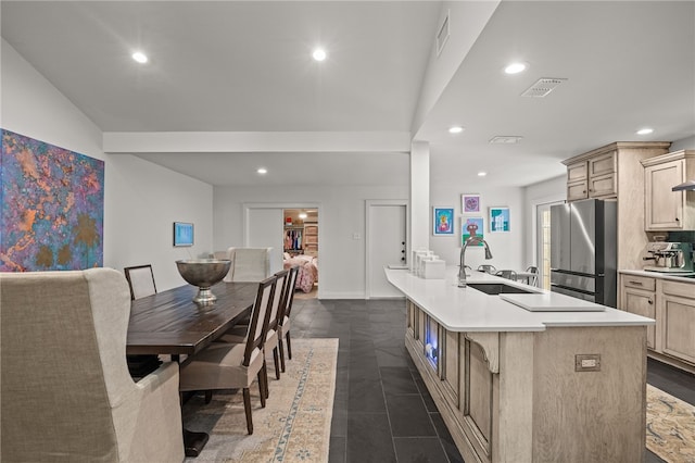 5418 Stonegate Way, Corpus Christi, TX 78411 - kitchen featuring freestanding refrigerator, recessed lighting, light brown cabinets, light countertops, and an island with sink
