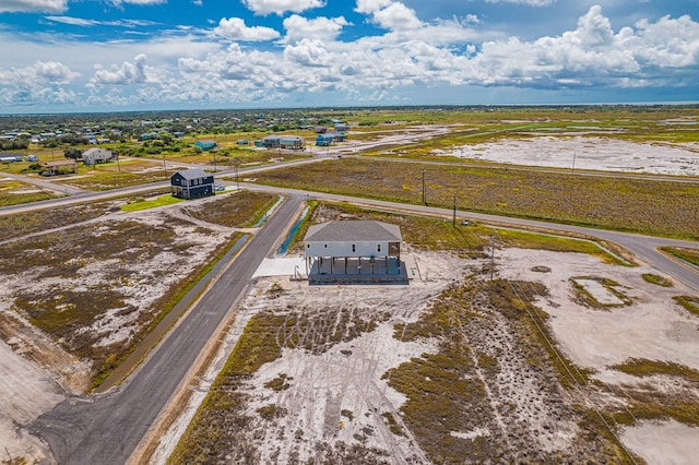 birds eye view of property with a rural view