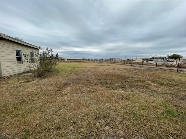 view of yard with a rural view