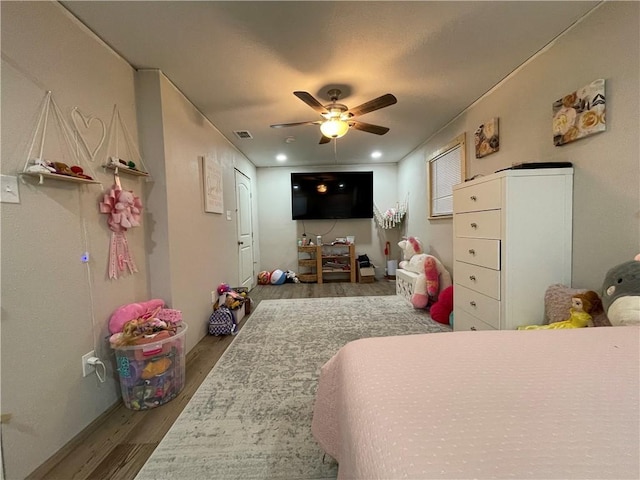 bedroom featuring wood-type flooring and ceiling fan