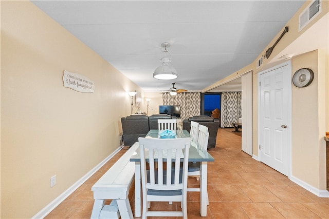 dining room featuring light tile patterned floors and ceiling fan