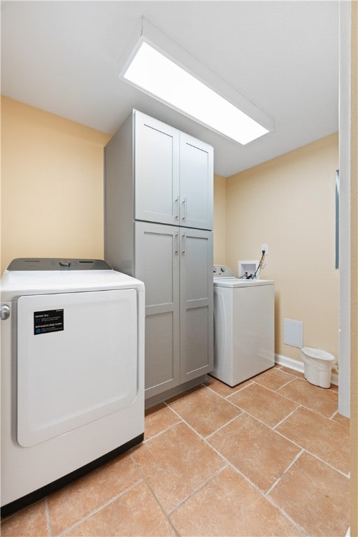 washroom featuring cabinets and light tile patterned floors