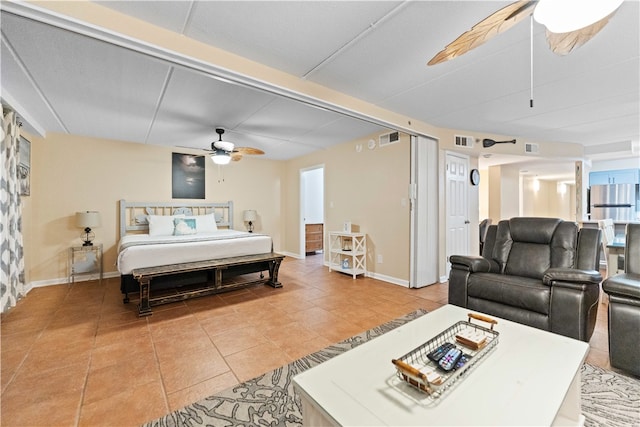 bedroom with tile patterned flooring and ceiling fan