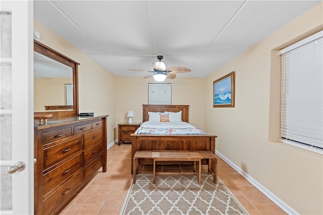 tiled bedroom with ceiling fan