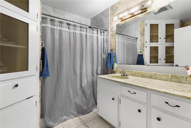 bathroom featuring vanity, tile patterned floors, and a shower with curtain