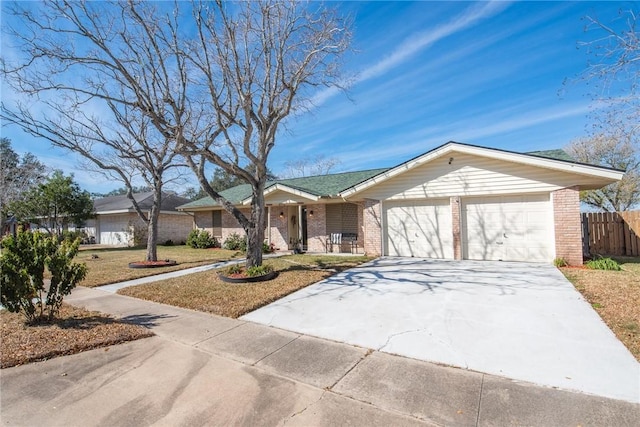 ranch-style home featuring a garage and a front yard