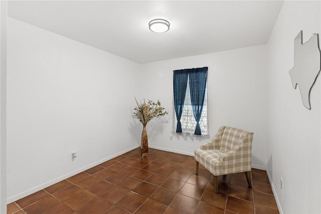 living area with dark tile patterned floors