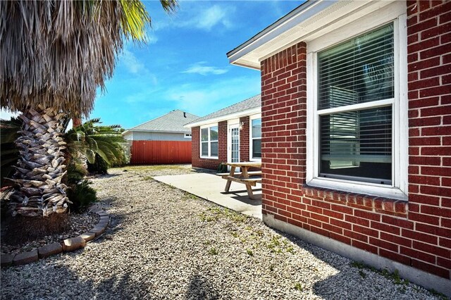 view of yard with a patio and fence