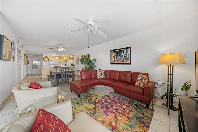 living room featuring ceiling fan and light tile patterned floors