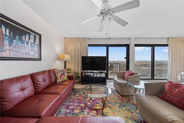 living room with tile patterned floors and ceiling fan