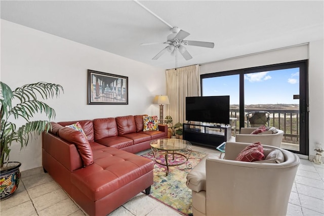 tiled living room with ceiling fan