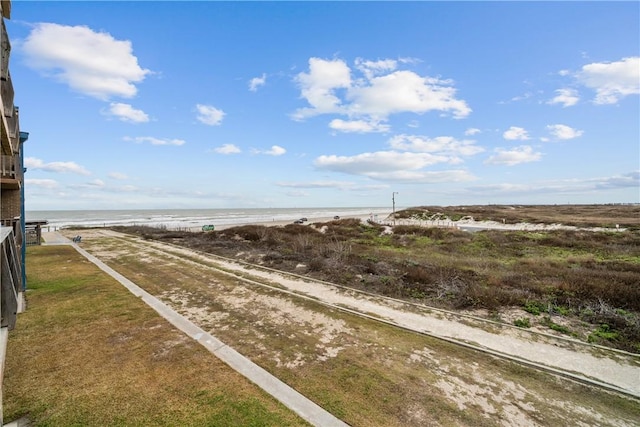 view of street with a view of the beach and a water view