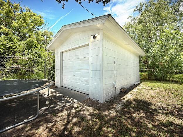 4546 Prescott St, Corpus Christi, TX 78416 - detached garage with a trampoline and driveway