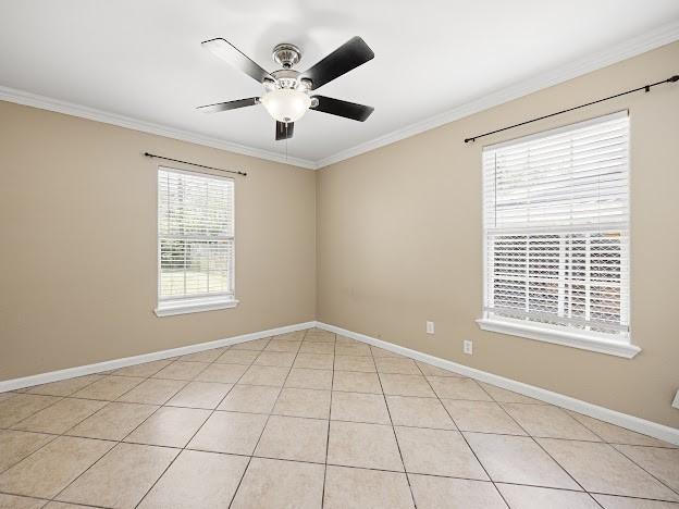 4546 Prescott St, Corpus Christi, TX 78416 - empty room featuring crown molding, a ceiling fan, and light tile patterned floors