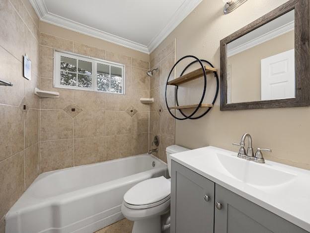 4546 Prescott St, Corpus Christi, TX 78416 - bathroom featuring ornamental molding, vanity, and bathing tub / shower combination