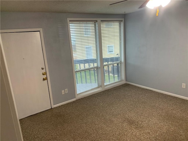 carpeted empty room with ceiling fan