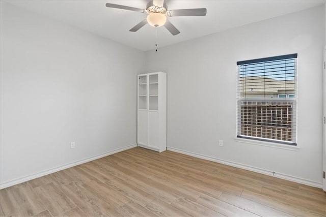 15101 Tesoro Dr, Corpus Christi, TX 78418 - empty room with wood finished floors and a ceiling fan
