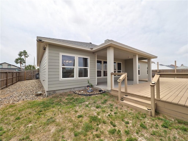 15101 Tesoro Dr, Corpus Christi, TX 78418 - back of property featuring a fenced backyard and a wooden deck