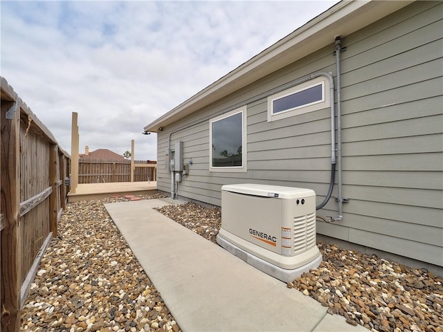 view of side of home with a fenced backyard