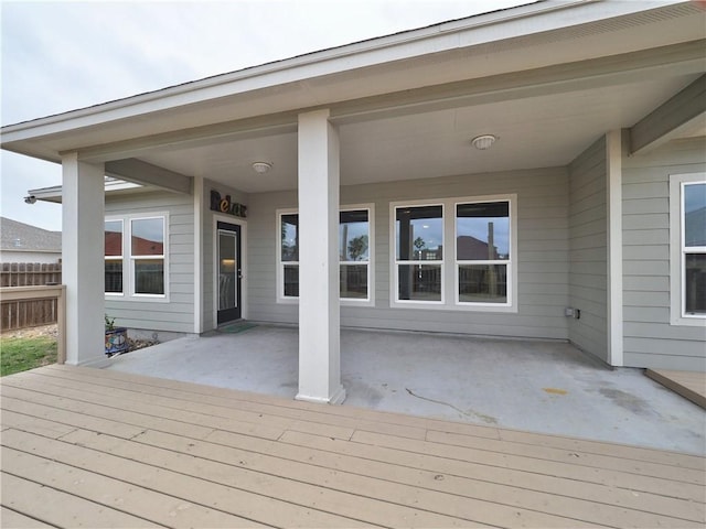 deck with fence and a patio