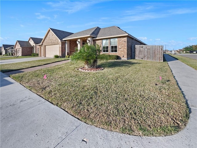 ranch-style home featuring a garage and a front yard