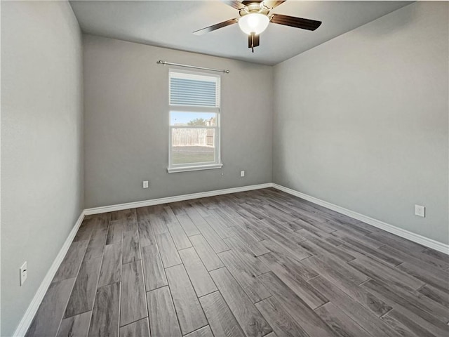 unfurnished room with hardwood / wood-style flooring and ceiling fan