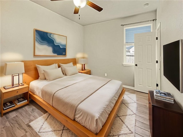 bedroom featuring ceiling fan and light wood-type flooring