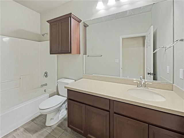 full bathroom featuring bathtub / shower combination, vanity, and toilet