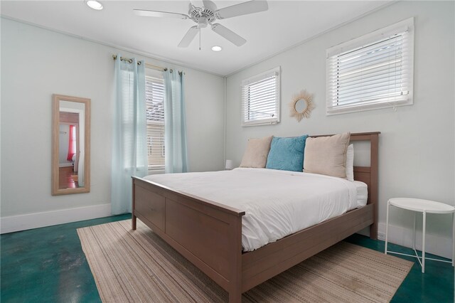 bedroom featuring concrete flooring, multiple windows, and ceiling fan