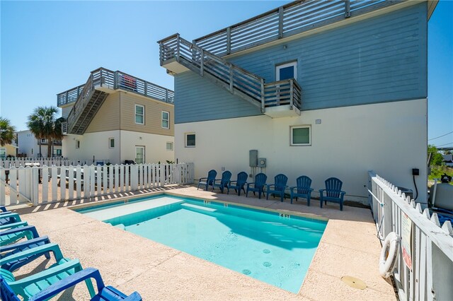 view of swimming pool featuring a patio area