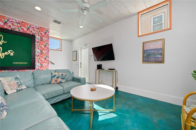 living room featuring ceiling fan and wood ceiling