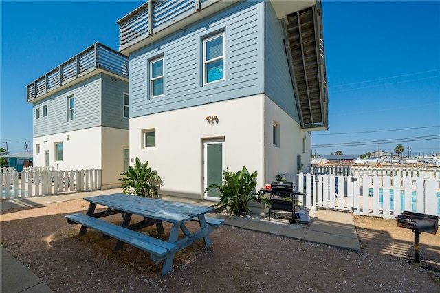 back of property with a patio area