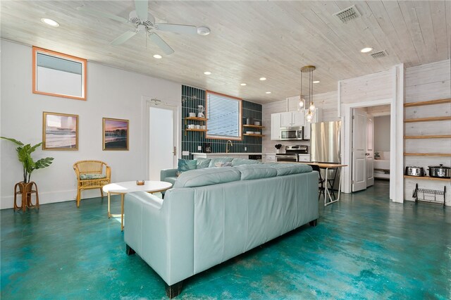 living room with wood ceiling, sink, and ceiling fan