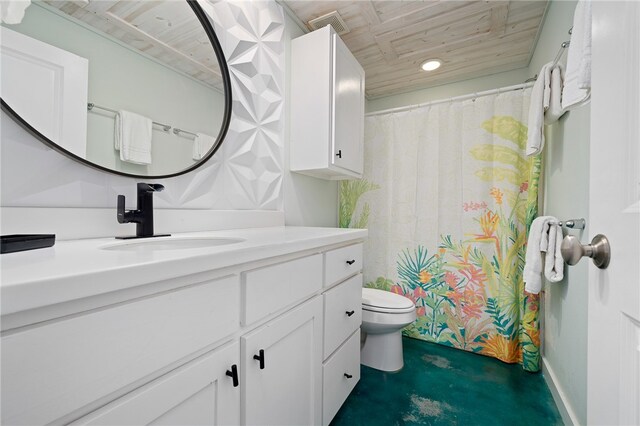 bathroom featuring concrete flooring, vanity, and toilet