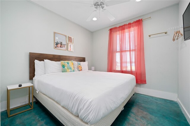 bedroom featuring ceiling fan and dark colored carpet