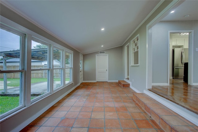 interior space featuring plenty of natural light and lofted ceiling