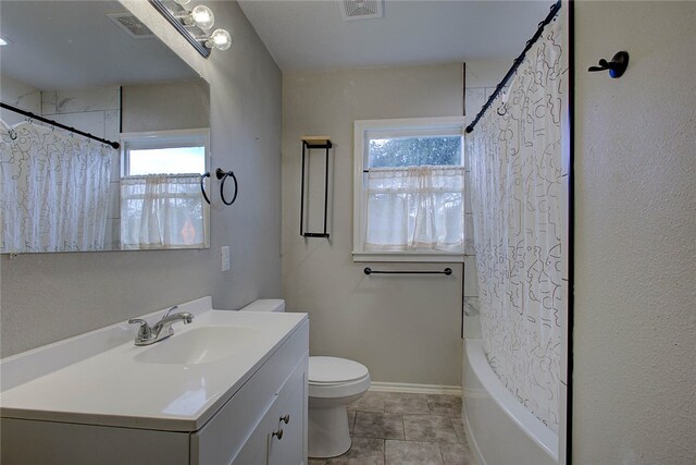 full bathroom featuring tile patterned flooring, shower / tub combo, vanity, and toilet